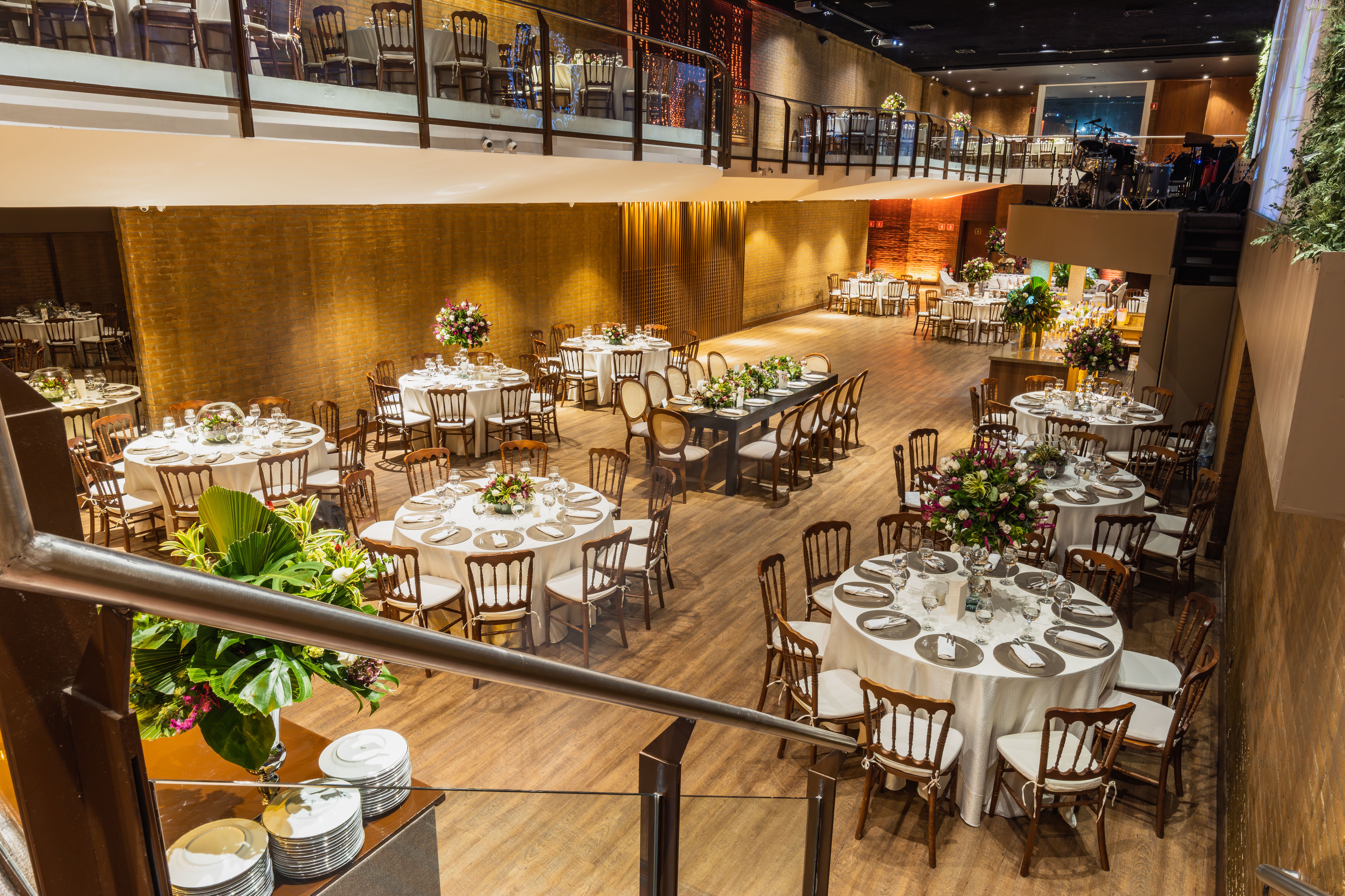 Luxurious wedding reception venue with beautifully decorated tables and elegant seating.