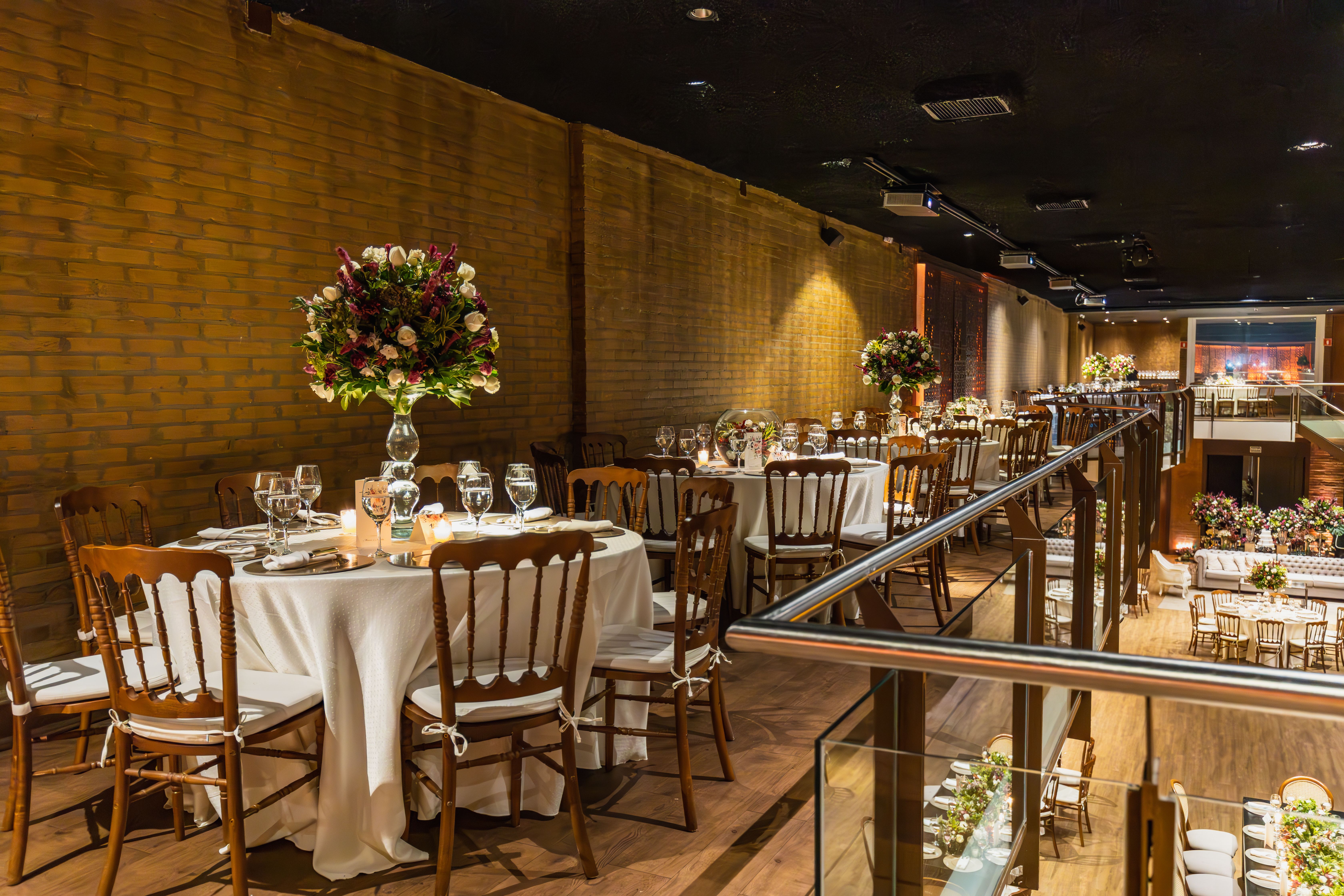 Beautifully decorated restaurant with elegant table settings ready for a celebration.